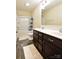 Bathroom featuring a double vanity, large mirror and shower with tub at 161 Old Harbor Dr, Mount Gilead, NC 27306