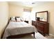 Bedroom featuring a queen bed, dresser with mirror and a nightstand at 161 Old Harbor Dr, Mount Gilead, NC 27306