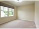 Bright bedroom with large windows and neutral carpeting at 161 Old Harbor Dr, Mount Gilead, NC 27306