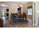 Inviting dining area with wood floors, stylish rug, and modern light fixture at 161 Old Harbor Dr, Mount Gilead, NC 27306