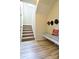 Welcoming entryway featuring a bench with coat hooks and staircase at 161 Old Harbor Dr, Mount Gilead, NC 27306