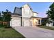 Lovely home with a spacious driveway leading to a two-car garage, set against a serene dusk backdrop at 161 Old Harbor Dr, Mount Gilead, NC 27306