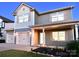 Charming two-story home with a two-car garage, complemented by an inviting landscaped front yard at 161 Old Harbor Dr, Mount Gilead, NC 27306