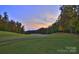 Expansive view of lush golf course with mature trees and a serene atmosphere at 161 Old Harbor Dr, Mount Gilead, NC 27306
