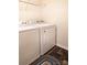 Practical laundry room featuring a washer, dryer, and overhead shelving at 161 Old Harbor Dr, Mount Gilead, NC 27306