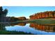 Scenic view of a tranquil pond reflecting the trees, showcasing the natural beauty of the community at 161 Old Harbor Dr, Mount Gilead, NC 27306