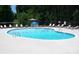 Community pool features crystal-clear water, lounge chairs, and a relaxing atmosphere at 161 Old Harbor Dr, Mount Gilead, NC 27306