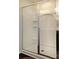 Bathroom shower with glass door, white surround and chrome fixtures at 161 Old Harbor Dr, Mount Gilead, NC 27306