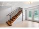 Basement features stairs with metal railing and door to outside at 1753 28Th Ne St, Hickory, NC 28601