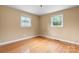 Bedroom with hardwood floors, neutral paint, and natural light from two windows at 1753 28Th Ne St, Hickory, NC 28601