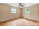 Bedroom with hardwood flooring, cream walls, a ceiling fan, and two windows at 1753 28Th Ne St, Hickory, NC 28601