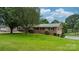 A brick ranch home with a manicured lawn, mature trees, and a welcoming facade at 1753 28Th Ne St, Hickory, NC 28601