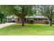 Charming brick home featuring a covered carport, mature trees and lush landscaping at 1753 28Th Ne St, Hickory, NC 28601
