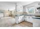 Bright kitchen features white cabinets, blue countertops, and an open eat-in kitchen area at 1753 28Th Ne St, Hickory, NC 28601