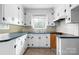 Traditional kitchen with white cabinetry, blue countertops, and a single window above the sink at 1753 28Th Ne St, Hickory, NC 28601