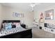 Bright bedroom with a black bed, vanity table, disco ball and colorful wall decor at 2042 Newport Dr, Fort Mill, SC 29707