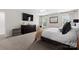 Large bedroom featuring a bed, dresser, and big windows with natural light at 2042 Newport Dr, Fort Mill, SC 29707