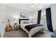 Relaxing bedroom showcasing a bed with nightstands, a guitar, and blue curtains at 2042 Newport Dr, Fort Mill, SC 29707