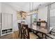 Elegant dining room featuring a modern chandelier, wainscoting, neutral paint, and a large table with seating at 2042 Newport Dr, Fort Mill, SC 29707