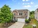 Charming two-story home featuring a two-car garage, well-maintained landscaping, and beautiful curb appeal at 2042 Newport Dr, Fort Mill, SC 29707