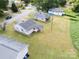 Aerial view captures several homes on a tree-lined neighborhood street at 206 13Th St, Belmont, NC 28012