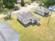 A top-down shot displaying a quaint home with a lush green yard, offering a sense of space and landscaping at 206 13Th St, Belmont, NC 28012