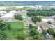 A scenic aerial view captures the homes neighborhood near a river and green trees at 206 13Th St, Belmont, NC 28012