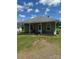 Charming single-story home with a front porch and a well-maintained lawn under a bright blue, sunny sky at 206 13Th St, Belmont, NC 28012