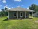 Charming single-story home with a front porch and a well-maintained lawn under a bright blue, sunny sky at 206 13Th St, Belmont, NC 28012