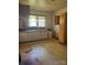 Outdated kitchen with wood cabinets, tiled countertops, and a vintage aesthetic at 206 13Th St, Belmont, NC 28012