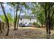 Expansive backyard featuring a wooden fence and a multi-tiered dark wood deck at 2112 Flint Glenn Ln, Charlotte, NC 28262
