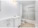 Bathroom with white vanity, toilet, and shower/tub combination with sliding glass doors at 2112 Flint Glenn Ln, Charlotte, NC 28262