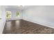 Bedroom with two windows offering natural light and wood-look flooring at 2112 Flint Glenn Ln, Charlotte, NC 28262