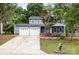 Charming two-story home featuring a two-car garage, landscaped front yard, and inviting curb appeal at 2112 Flint Glenn Ln, Charlotte, NC 28262