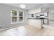 Eat in kitchen featuring granite counters, tile floors, white cabinetry, and natural light at 2112 Flint Glenn Ln, Charlotte, NC 28262