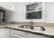 Kitchen sink area with granite counters, stainless steel sink, and window at 2112 Flint Glenn Ln, Charlotte, NC 28262