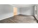 Spacious living room with modern wood-look flooring, neutral paint, and ample natural light at 2112 Flint Glenn Ln, Charlotte, NC 28262