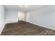 Spacious living room featuring hard surface flooring and access to adjacent rooms at 2112 Flint Glenn Ln, Charlotte, NC 28262