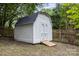 Exterior view of a white storage shed with double doors and a ramp at 2112 Flint Glenn Ln, Charlotte, NC 28262