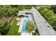 Stunning aerial view of home showcasing pool, manicured lawn and gray exterior at 2121 Valencia Ter, Charlotte, NC 28226