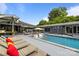 Stunning backyard oasis with a refreshing pool, lounge chairs, and a spacious deck, perfect for outdoor relaxation at 2121 Valencia Ter, Charlotte, NC 28226