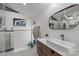 Well-lit bathroom with a modern sink, sleek vanity, and stylish mirror at 2121 Valencia Ter, Charlotte, NC 28226
