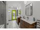 Bright bathroom with double sink vanity and a walk-in tiled shower at 2121 Valencia Ter, Charlotte, NC 28226