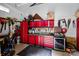 Organized garage featuring red storage and tool cabinets at 2121 Valencia Ter, Charlotte, NC 28226