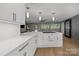 Gourmet kitchen with a large island, white marble countertops, stainless steel appliances, and stylish fixtures at 2121 Valencia Ter, Charlotte, NC 28226