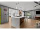 Modern kitchen with an island, stainless steel appliances, and pendant lighting at 2121 Valencia Ter, Charlotte, NC 28226