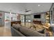 Bright living room features wood-paneled walls and an open layout into the kitchen at 2121 Valencia Ter, Charlotte, NC 28226