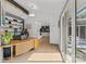 Bright office with hardwood floors, built-in shelving, a modern desk, and a glass sliding door to the outside at 2121 Valencia Ter, Charlotte, NC 28226