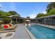 Backyard with pool and lounge area, perfect for entertaining and relaxing outdoors at 2121 Valencia Ter, Charlotte, NC 28226