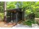 View of a screened porch featuring gray trim and an exterior entrance at 2121 Valencia Ter, Charlotte, NC 28226